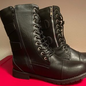 Zip up boots with ties. Buckles on the side.